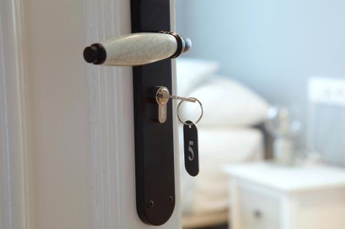a door handle with a key in a room at La Torre de Guardiola in Guardiola de Berguedà