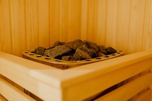 a bowl of rocks in a corner of a room at Muller Hotel Boutique & Spa in Galaţi