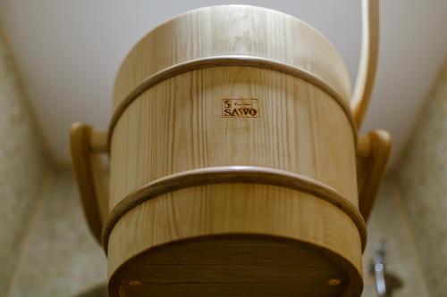 a wooden chair with the word saoko written on it at Muller Hotel Boutique & Spa in Galaţi