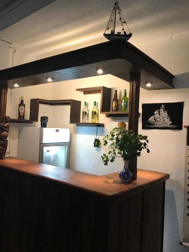 a kitchen with a counter with a plant on it at Unawatuna Beach Bungalow - in Unawatuna