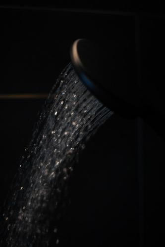 a close up of a black object with water on it at Hotel Nice in Laupheim