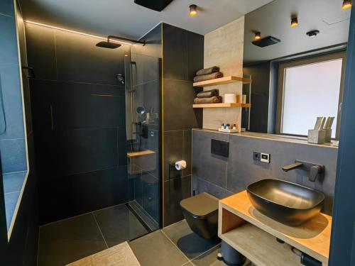 a bathroom with a sink and a shower at Hotel Nice in Laupheim