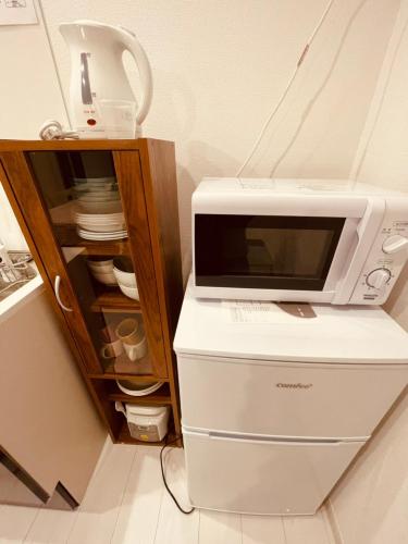 Una cocina o zona de cocina en 羽田ハウスⅡ