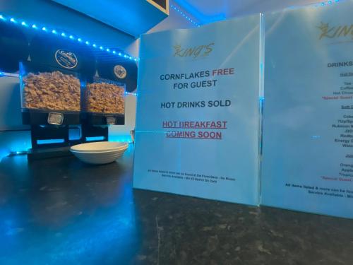 a sign in a room with some food on a table at King Street Hotel in Blackburn