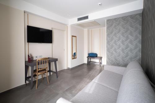 a living room with a couch and a table at Hotel Palace in Catanzaro Lido