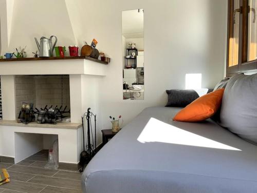 a bedroom with a bed and a fireplace at La casina di Francy in Castelsantangelo sul Nera