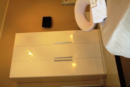 a white dresser in a bathroom with a towel at B&B Tra Monti e Mare in Ogliastro Cilento