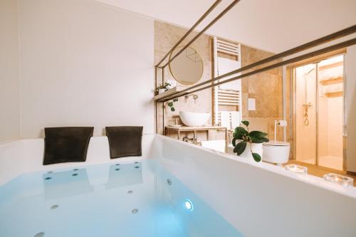 a bath tub in a bathroom with a window at Suite1212 - Pirrelli in Monopoli