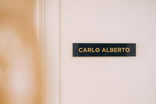 a sign on a door that reads carolina algebra at Suite1212 - Pirrelli in Monopoli