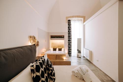 a living room with a couch and a table at Suite1212 - Pirrelli in Monopoli