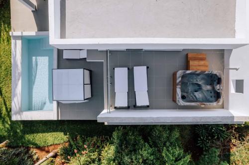a model of a house with a car in it at Safira Blu Luxury Resort & Villas in Nungwi