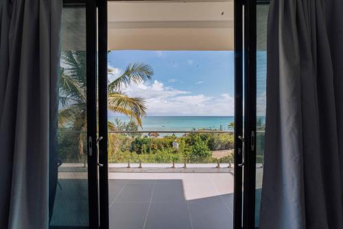 a window view of the ocean from a house at Safira Blu Luxury Resort & Villas in Nungwi
