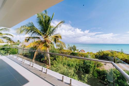a balcony with a view of the ocean at Safira Blu Luxury Resort & Villas in Nungwi