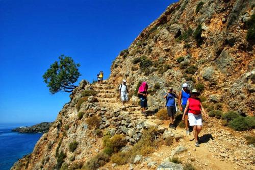 a group of people walking up a rocky mountain at Traditional Villa Askyfou in Karés