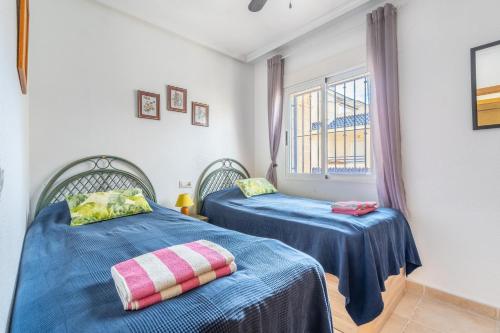 Postel nebo postele na pokoji v ubytování Bungalow in Torrevieja