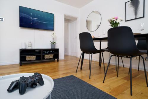 a living room with a table and chairs at Best Location Oxford Str, Soho 2 Bedr, 3 Beds, 2 Bath in London