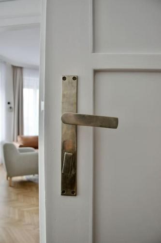 a door with a handle in a living room at Premium Apartment by Hi - Central 2 BR - best view in Budapest