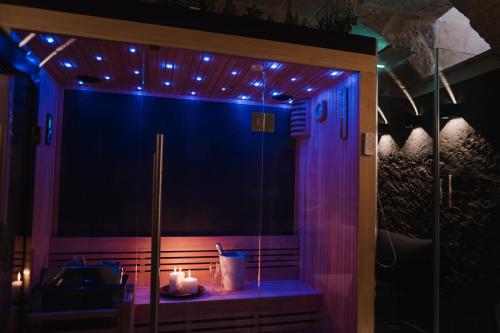 a room with a shower with candles and lights at Suite1212 - Pirrelli in Monopoli