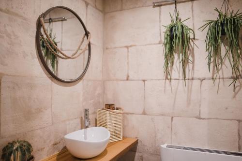 a bathroom with a sink and a mirror on the wall at Suite1212 - Pirrelli in Monopoli