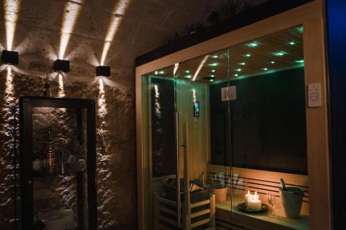 a room with a glass door with lights on it at Suite1212 - Pirrelli in Monopoli