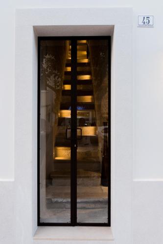 a view of a staircase through a glass window at Suite1212 - Pirrelli in Monopoli