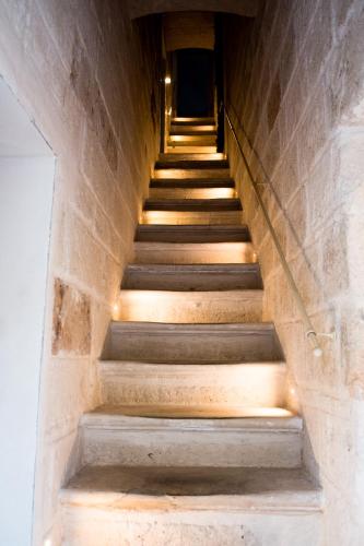 a staircase in a building with lights on it at Suite1212 - Pirrelli in Monopoli