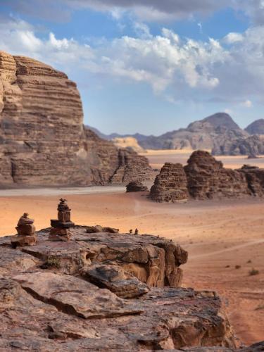a view of the desert with mountains and rocks at White Desert Camp in Wadi Rum