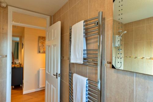 a bathroom with a towel rack on the wall at Finest Retreats - Southern Lea in Burnham on Sea