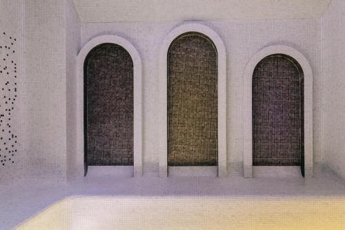 a rendering of three windows in a building at Mandachi Hotel & SPA in Suceava
