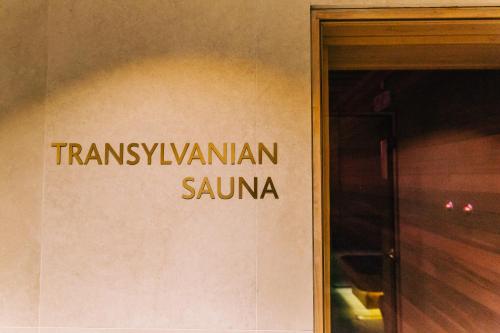 a sign on the side of a building at Mandachi Hotel & SPA in Suceava