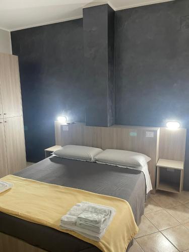 Ένα ή περισσότερα κρεβάτια σε δωμάτιο στο B&B Menna Vence