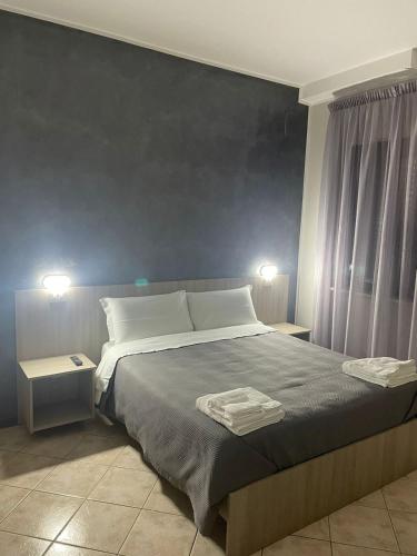 Ένα ή περισσότερα κρεβάτια σε δωμάτιο στο B&B Menna Vence