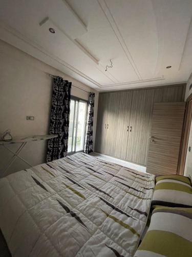 Ein Bett oder Betten in einem Zimmer der Unterkunft Agréable et Spacieux appartement 1min de la plage