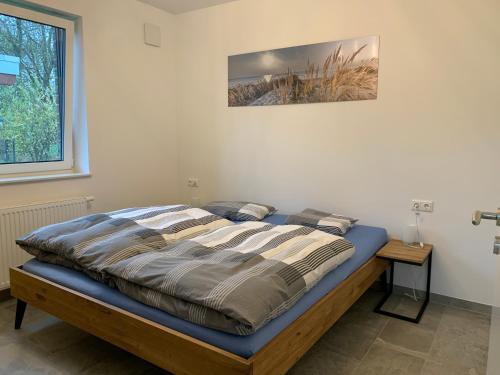 Postel nebo postele na pokoji v ubytování Ankerplatz Ferienhaus Sehestedt
