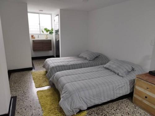 Cama o camas de una habitación en Acogedor apartamento zona Norte