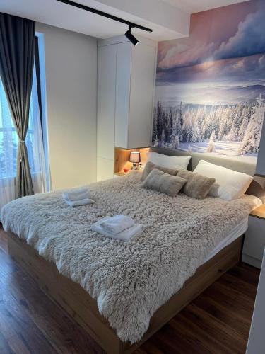 Кровать или кровати в номере Apartmani TIM Ariš Resort