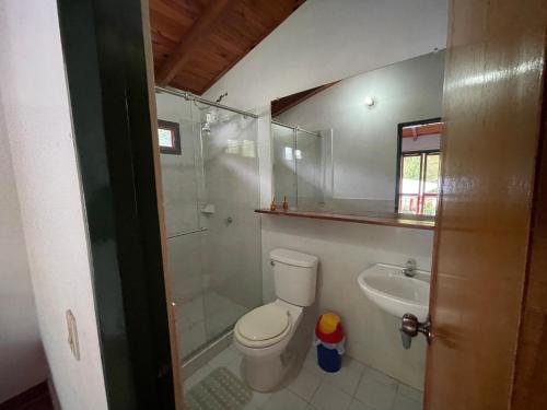 a bathroom with a shower and a toilet and a sink at El Gran Mirador in Buenavista