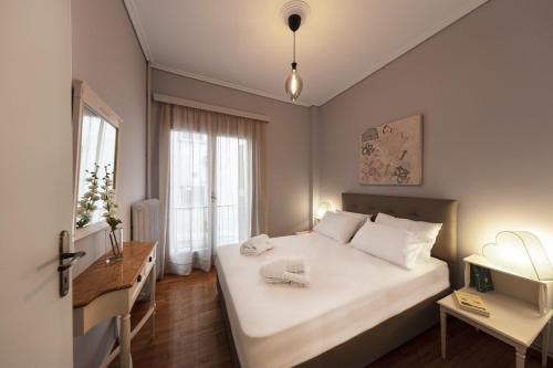 Posteľ alebo postele v izbe v ubytovaní Spacious 3 Bedroom apt near Acropolis museum