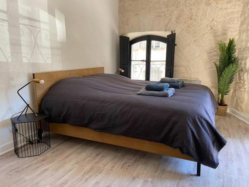Posteľ alebo postele v izbe v ubytovaní Appartement de standing au cœur d’Avignon