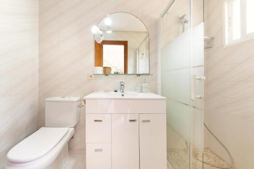a bathroom with a toilet and a sink and a shower at BeOnHolidays Villa Berry in Santa Ponsa