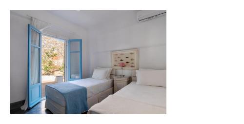 Ένα ή περισσότερα κρεβάτια σε δωμάτιο στο Morfia Villas