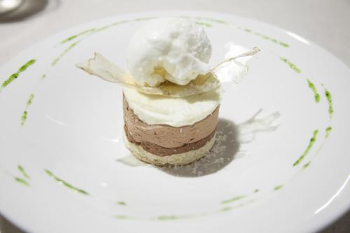 a dessert on a plate on a table at Hotel Miba in Salobreña
