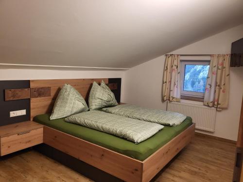 Postel nebo postele na pokoji v ubytování Saumerhof
