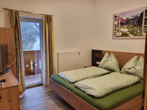 Postel nebo postele na pokoji v ubytování Saumerhof