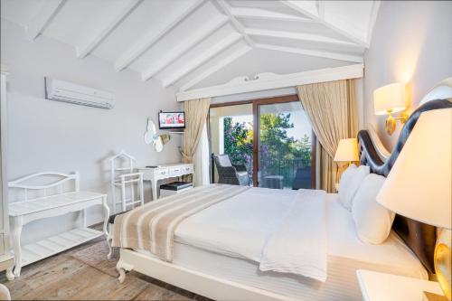 Ένα ή περισσότερα κρεβάτια σε δωμάτιο στο Alya Villa Butik Hotel