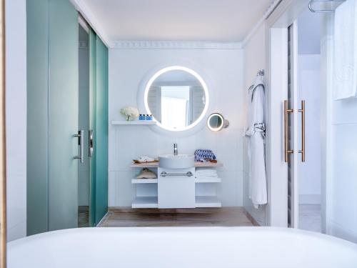 a bathroom with a sink and a mirror at Sofitel Dubai Jumeirah Beach in Dubai