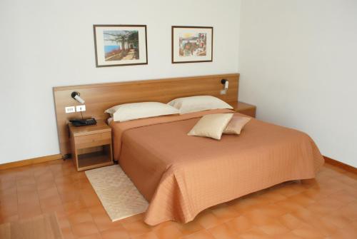 Postel nebo postele na pokoji v ubytování Albergo "da Mario"