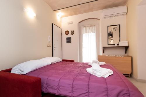 Ένα ή περισσότερα κρεβάτια σε δωμάτιο στο Lerici Natural Suite con Wi-Fi