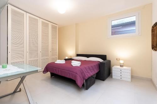 Ένα ή περισσότερα κρεβάτια σε δωμάτιο στο Lerici Natural Suite con Wi-Fi