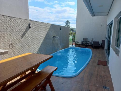 a swimming pool in the middle of a patio at Casa Capitolio in Capitólio